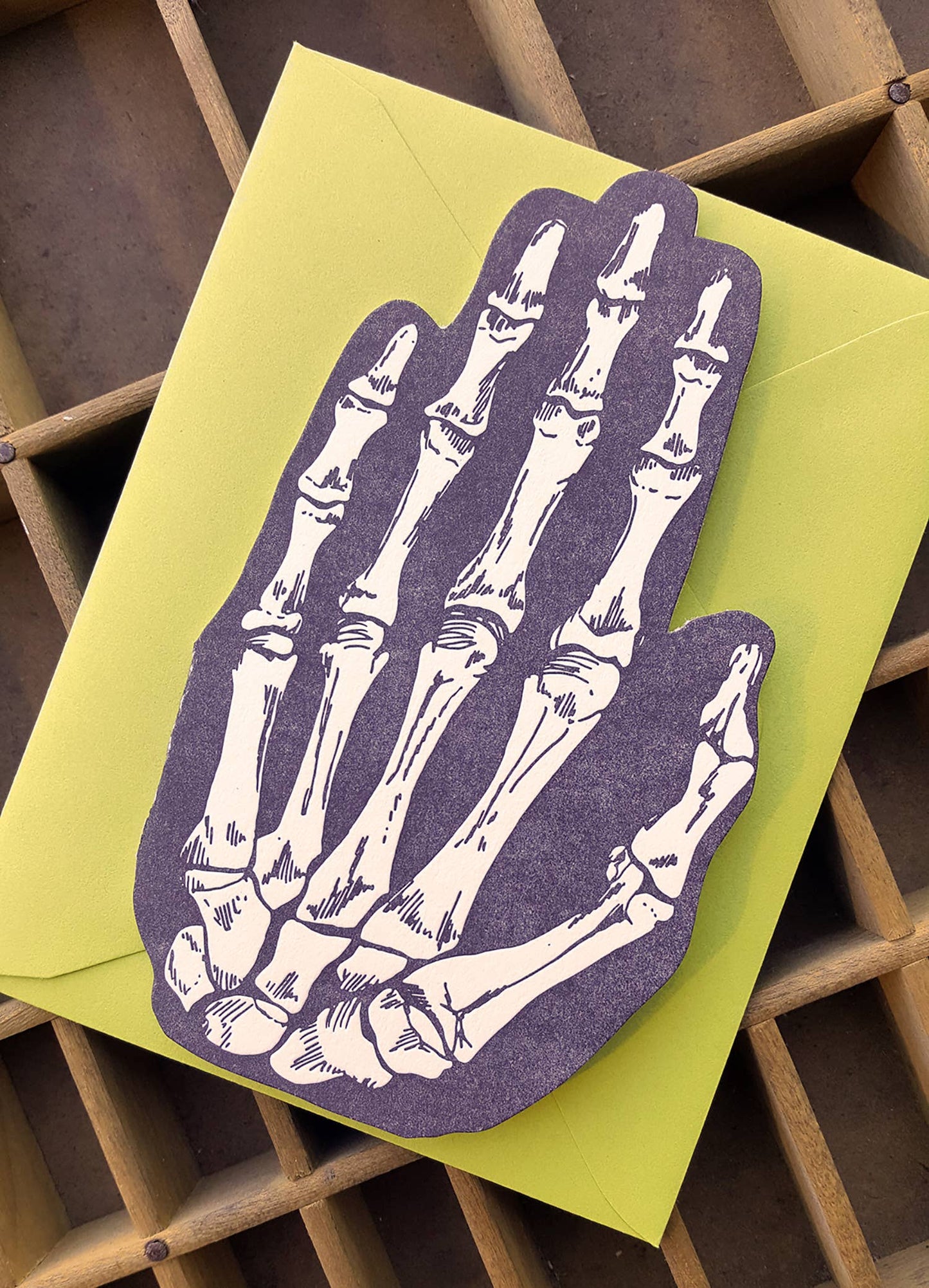 Skeleton hand shaped card