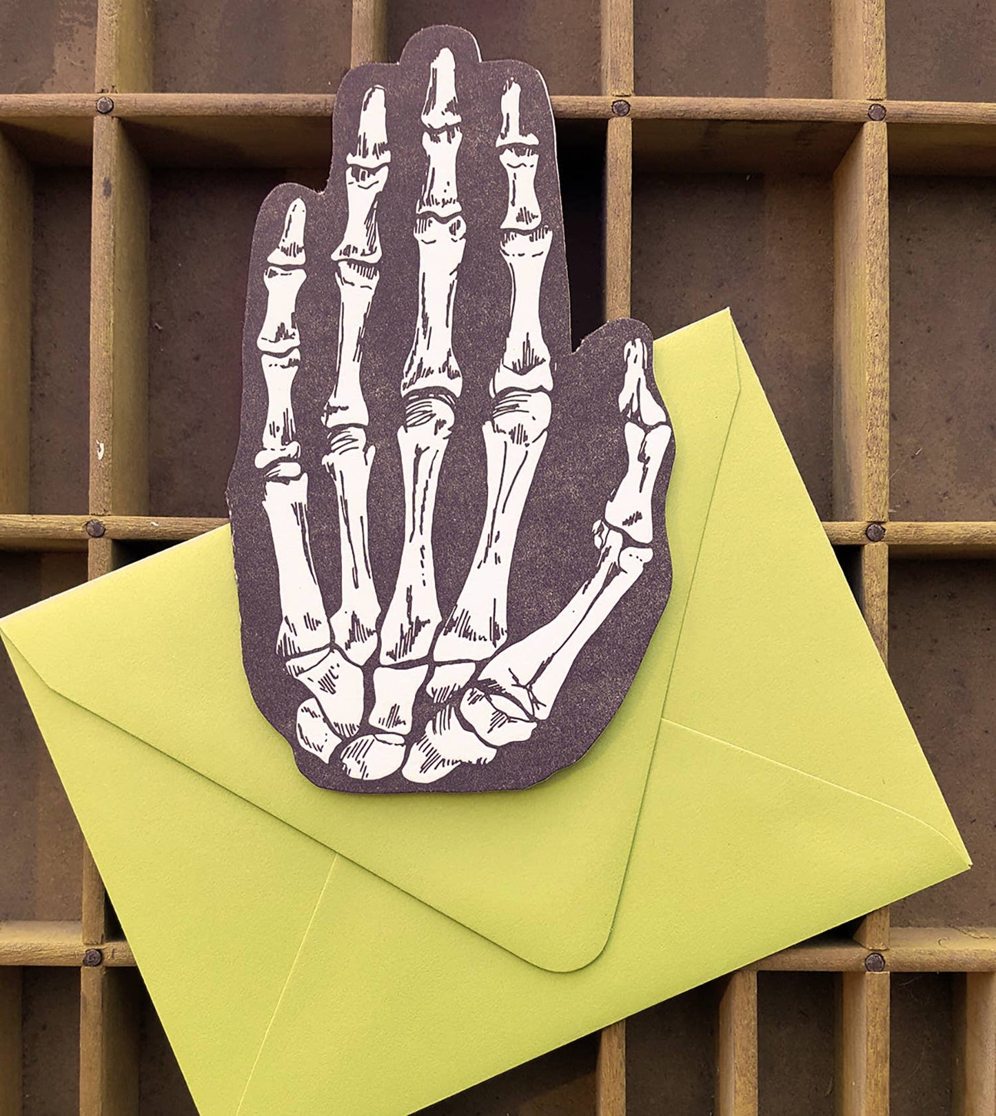 Skeleton hand shaped card